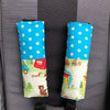 Padded shoulder strap covers in a cute camping and animals print with hook and loop closure. Will fit all pram harness straps for baby.