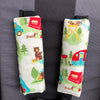 Black padded shoulder strap covers in a cute animal camping fabric with hook and loop closure. Will fit all pram harness straps for baby.